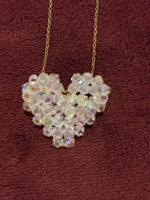 Gold necklace with crystal heart pendant