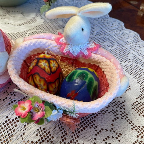 Easter decorations used, pink wicker baskets with rabbit and candle eggs