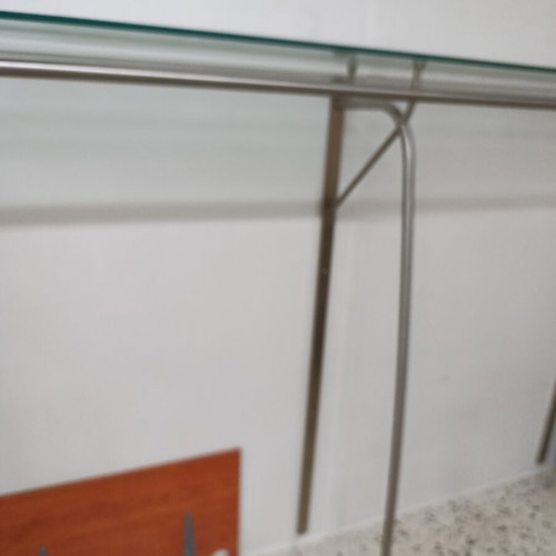 Stand with glass wall-mounted shelf used
