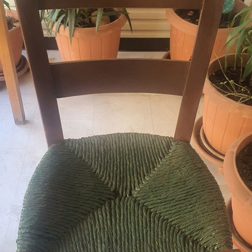 Wooden high chair with woven seat