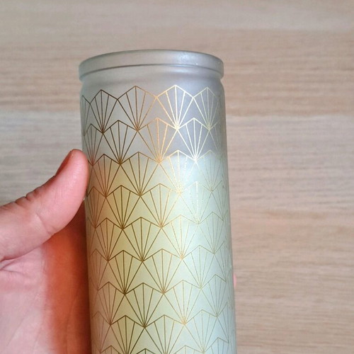White candle in container new