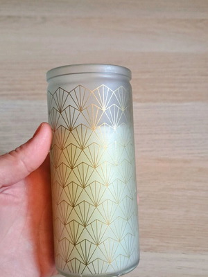 White candle in container new
