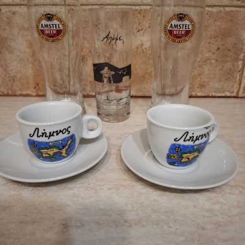 Cutlery set used, includes plates, forks, spoons, glasses, coffee cups
