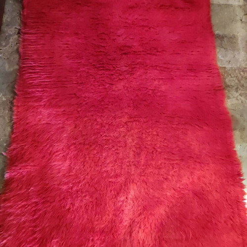 Red flokati rug used, traditional wool, approx. 230x140 cm