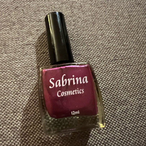 Nail polish with glitter in purple color like new