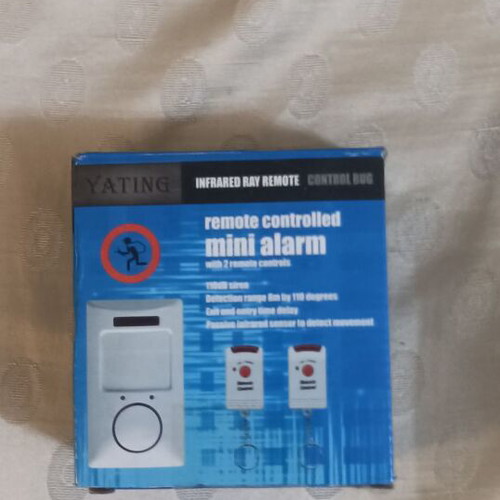 Mini Alarm like new with two remote controls and mounting bracket