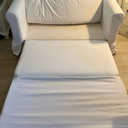 IKEA HAGALUND two-seater sofa bed, white