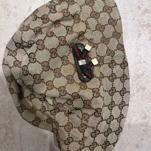 Gucci hat like new with metal details and brown lining
