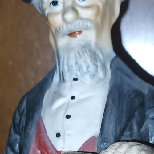 Vintage decorative figurine like new with seated old man