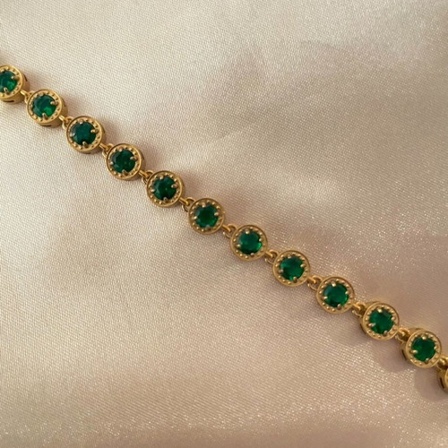 Riviera stainless steel bracelet new with green stones in gold color
