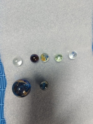 Set of 6 small and 1 large marbles like new