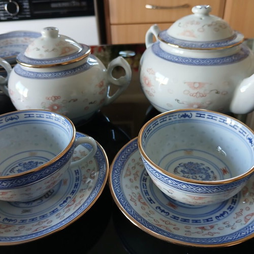 Tea set like new with teapot, creamer, sugar bowl, 5 cups and 10 saucers