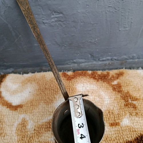 Old cezve handmade with engraved handle, used