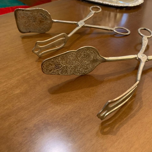 Silver-plated serving spoon and fork set used