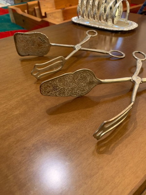 Silver-plated serving spoon and fork set used