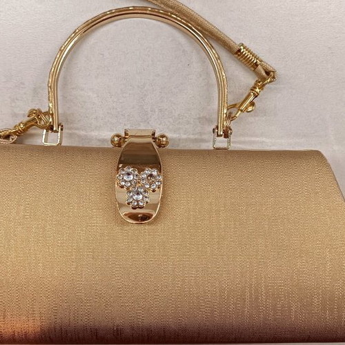 Gold evening handbag like new with missing rhinestone