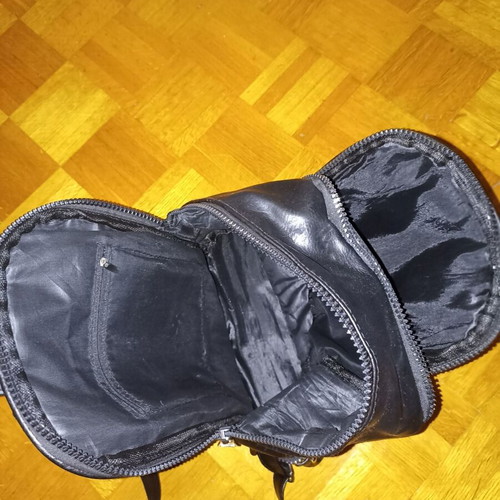 Backpack black leather type used with multiple pockets