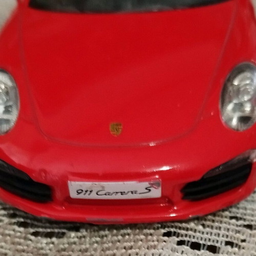 Collectible Porsche Carrera toy car with opening doors like new