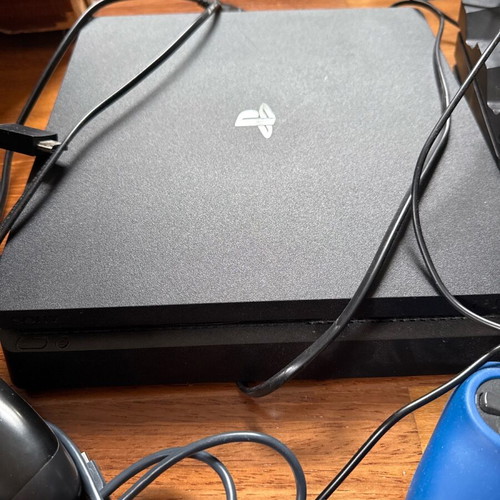 PlayStation 4 (PS4) like new with 2 charging stations, 4 controllers and cables