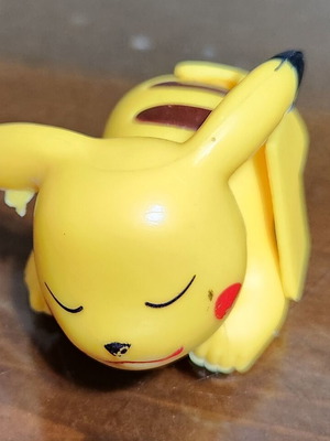 Collectible Pikachu figure used, sleeping pose, Pokémon