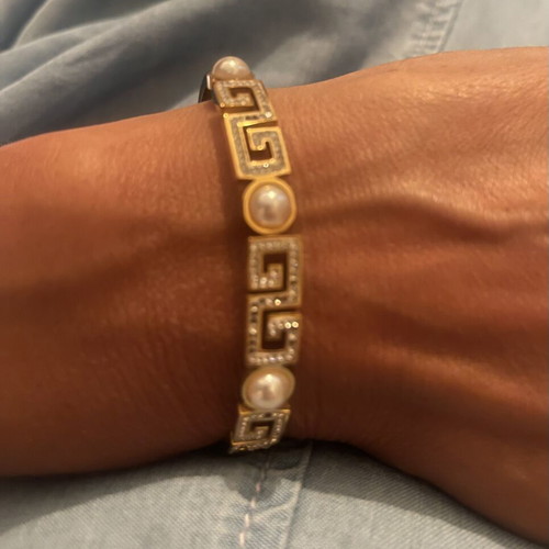 Steel bracelet used, gold color with meander design, crystals and pearls