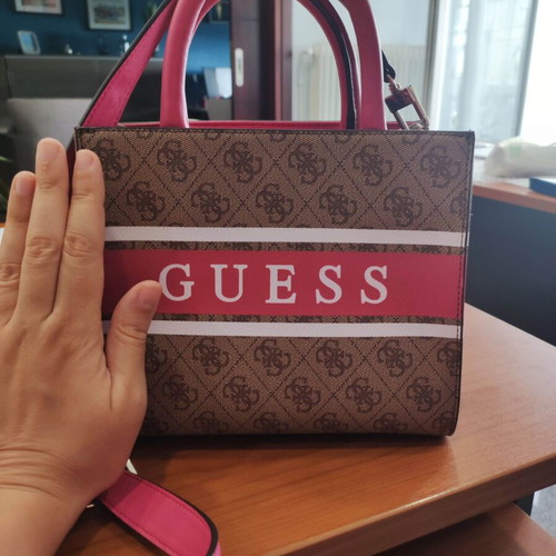 Guess handbag like new, fuchsia color with extra strap