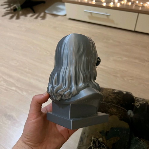 Ozzy figure silver like new