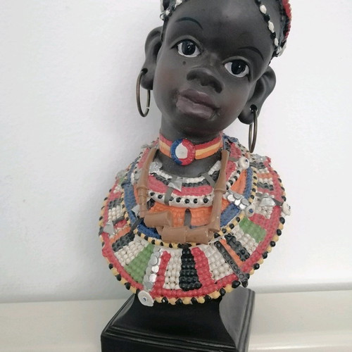 African figurine like new with intricate bead jewelry
