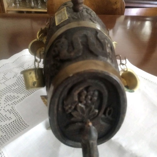 Antique barrel used with brass cups and carvings