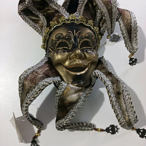 Decorative mask used, wall hanging, black with wear