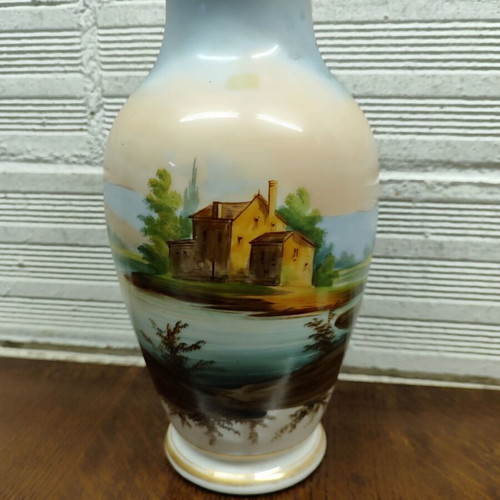 Old porcelain vase used, hand-painted with romantic scene
