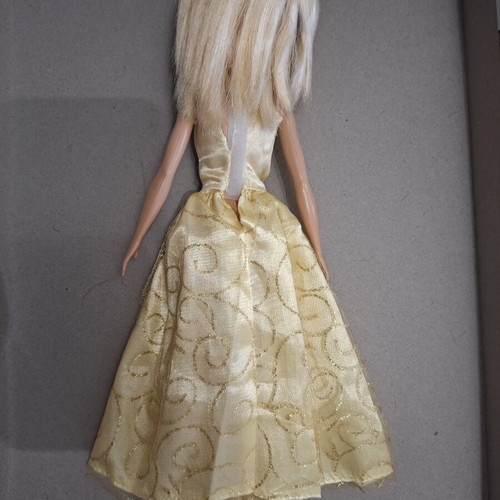 Barbie doll like new with golden dress