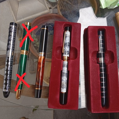 Pens in like-new condition with various designs