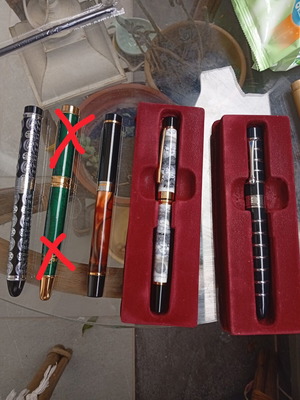 Pens in like-new condition with various designs