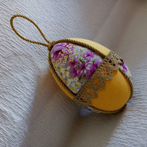 Decorative yellow floral egg used for Easter and spring decor