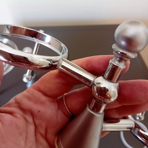 Two sets of inox bathroom accessories with glass and frosted parts