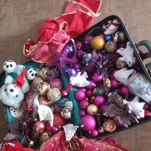 Vintage Christmas suitcase with decorations and Coca-Cola bears, used