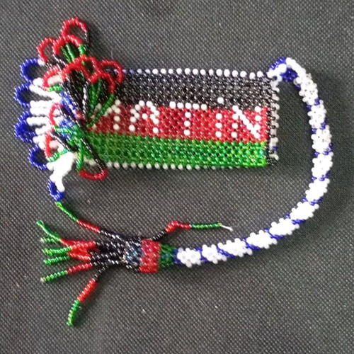 Beaded knitted case used, possibly for lighter or perfume bottle