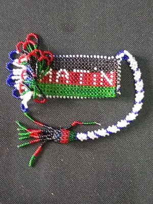 Beaded knitted case used, possibly for lighter or perfume bottle