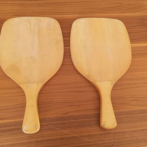 Wooden beach rackets with sun design used, pair
