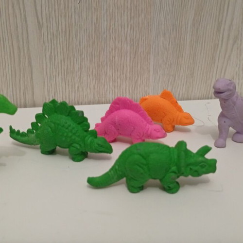 Vintage rubber dinosaur figures set used, 1980s monochrome erasers