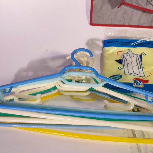 Set of 20 hangers and protective bags like new