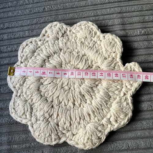 Knitted coaster used, flower-shaped, beige