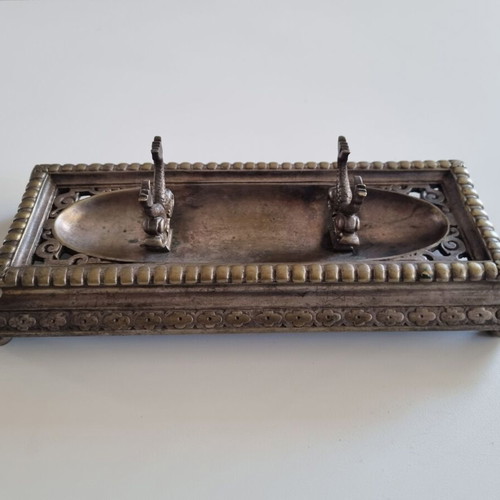 Vintage metal pen tray used with embossed floral motifs and dolphin supports