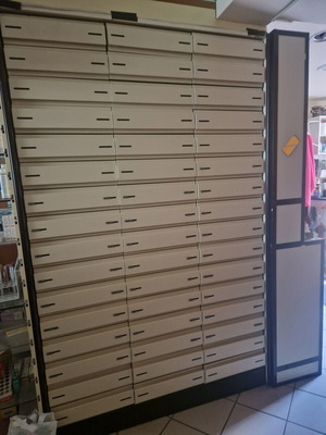 Pharmacy cabinet like new with 3 columns and 13 shelves