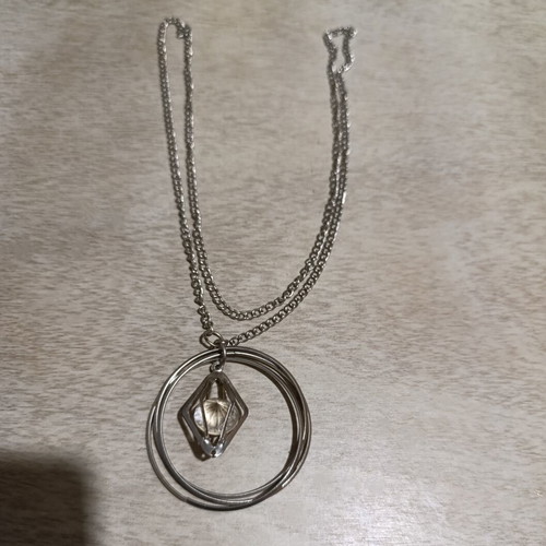 Silver necklace with transparent diamond used