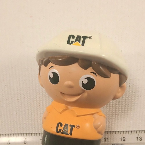 Cat plastic figurine used with ink marks