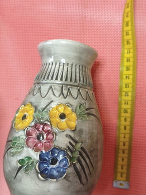 Vintage handmade ceramic vase with embossed flowers, used