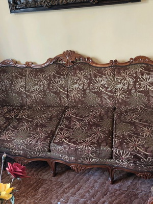 Classic living room refurbished with sofa, armchairs, chairs and marble tables