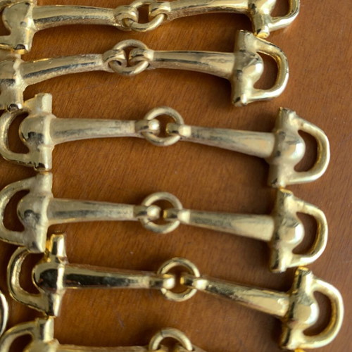Metal decorative snaffle bits 22 pieces like new, gold color